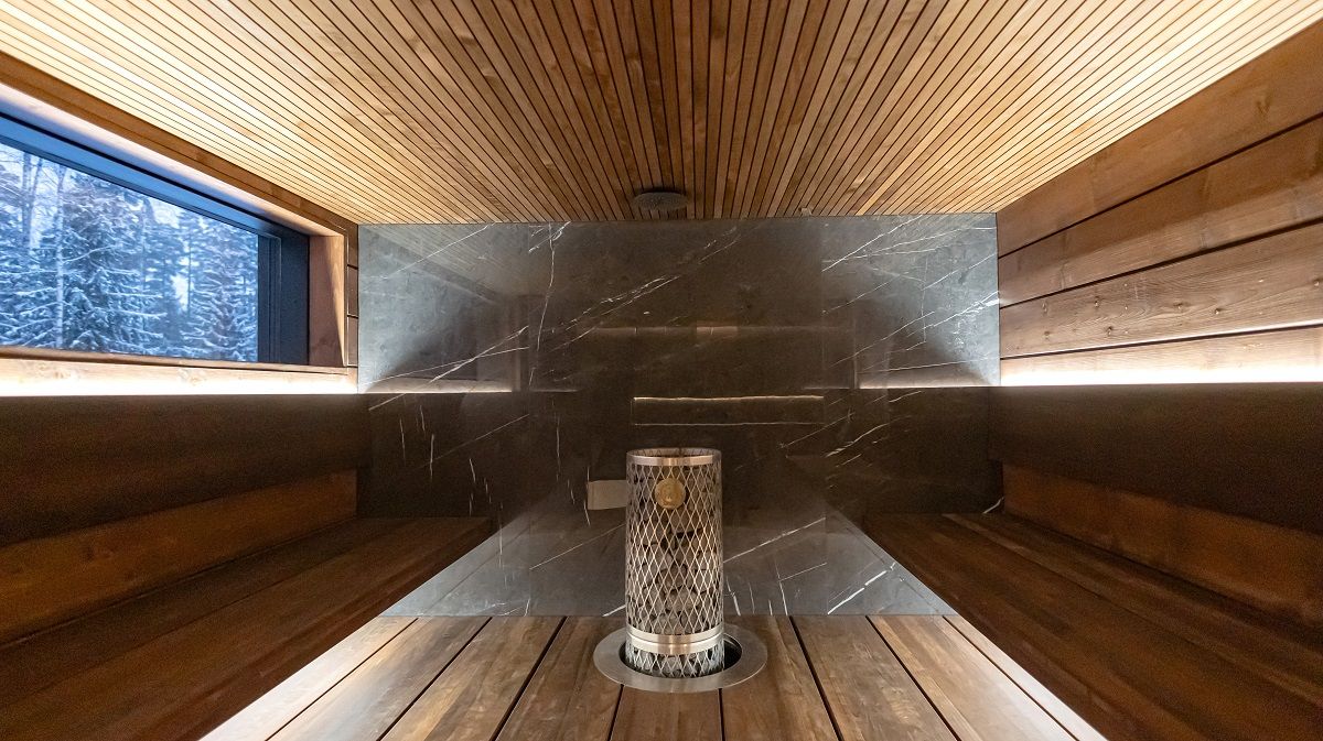 Indirect lighting on two levels in the sauna is sufficient for the entire space. The lights are mounted behind the backrest to illuminate upwards and under the seat to illuminate downwards